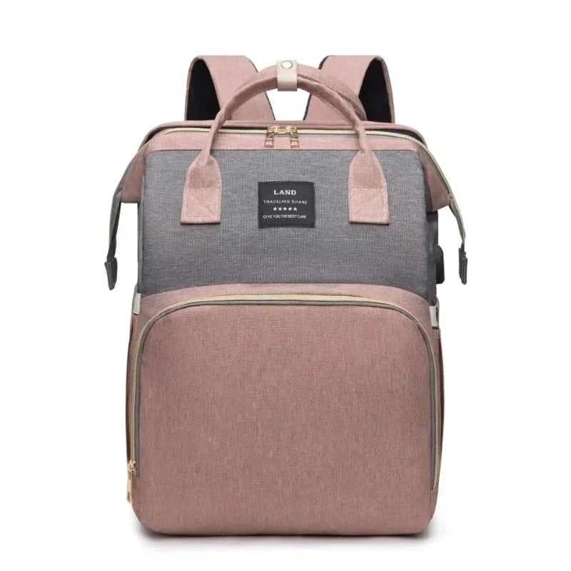 Mommy Bag – Wickelrucksack mit faltbarem Reisebett & großem Stauraum